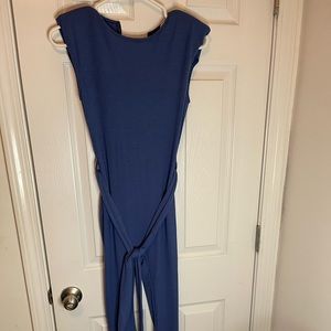 Blue romper with shoulder pads, size small never worn,